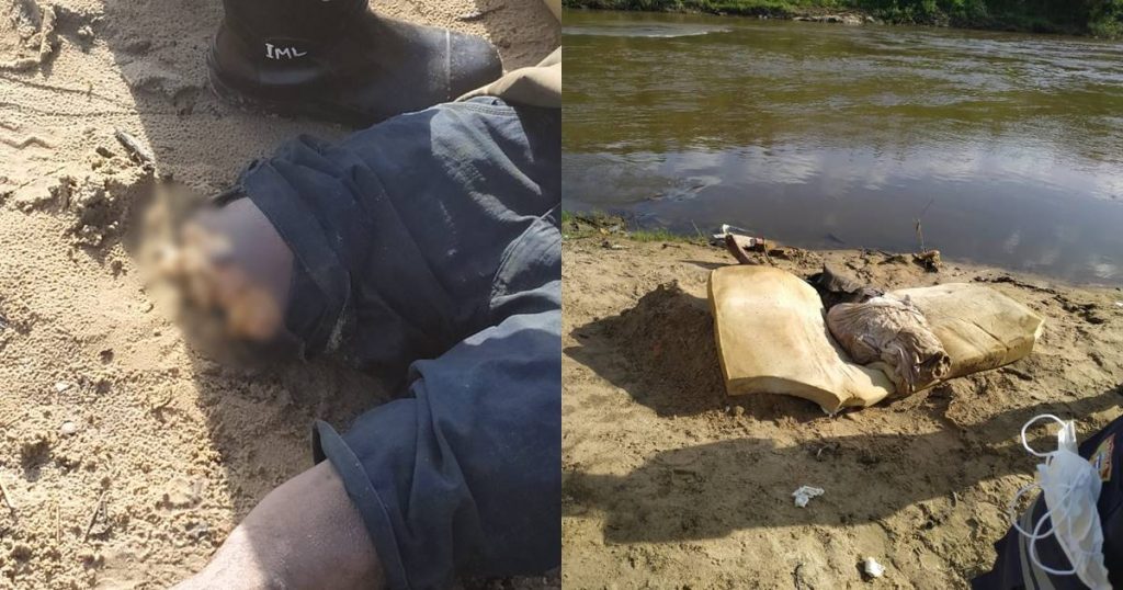 Corpo estava encalhado em uma pedra e foi retirado da água por mergulhadores do Corpo de Bombeiros — © Reprodução